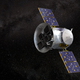 An artist's rendering of the TESS instrument in space. The object is a silver cylinder with panels extending on either side of it.
